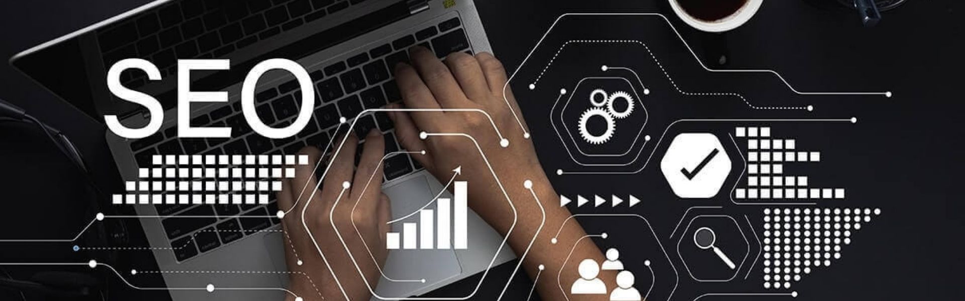 Hands typing on a laptop with SEO graphics and digital marketing icons